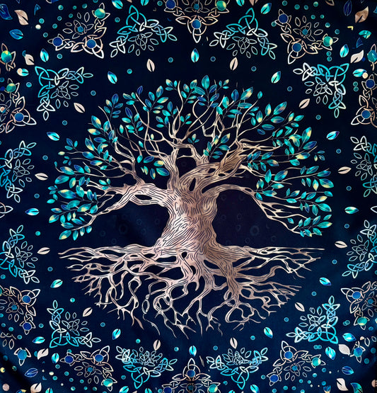 Black fabric tapestry featuring a large tree with leaves and celtic knot designs.
