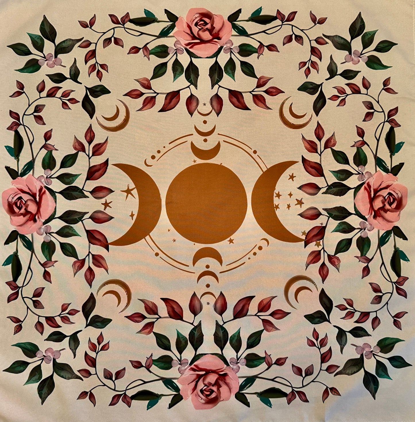 Square beige altar cloth with brown triple moon symbol and pink rose with green and red leaves border.
