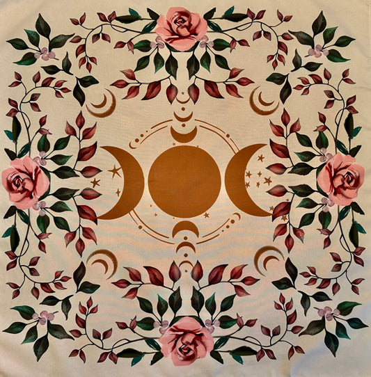 Square beige altar cloth with brown triple moon symbol and pink rose with green and red leaves border.