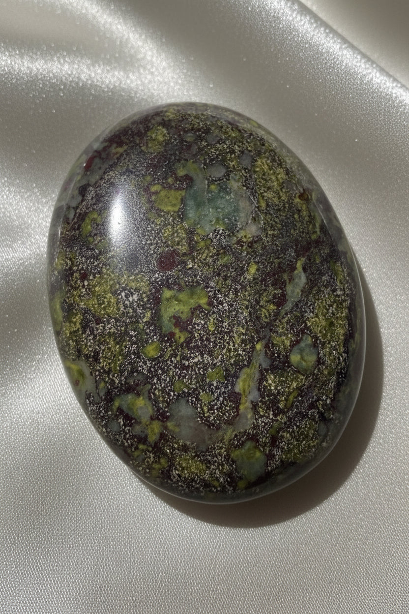 close up of a dragonsblood rystal polished stone