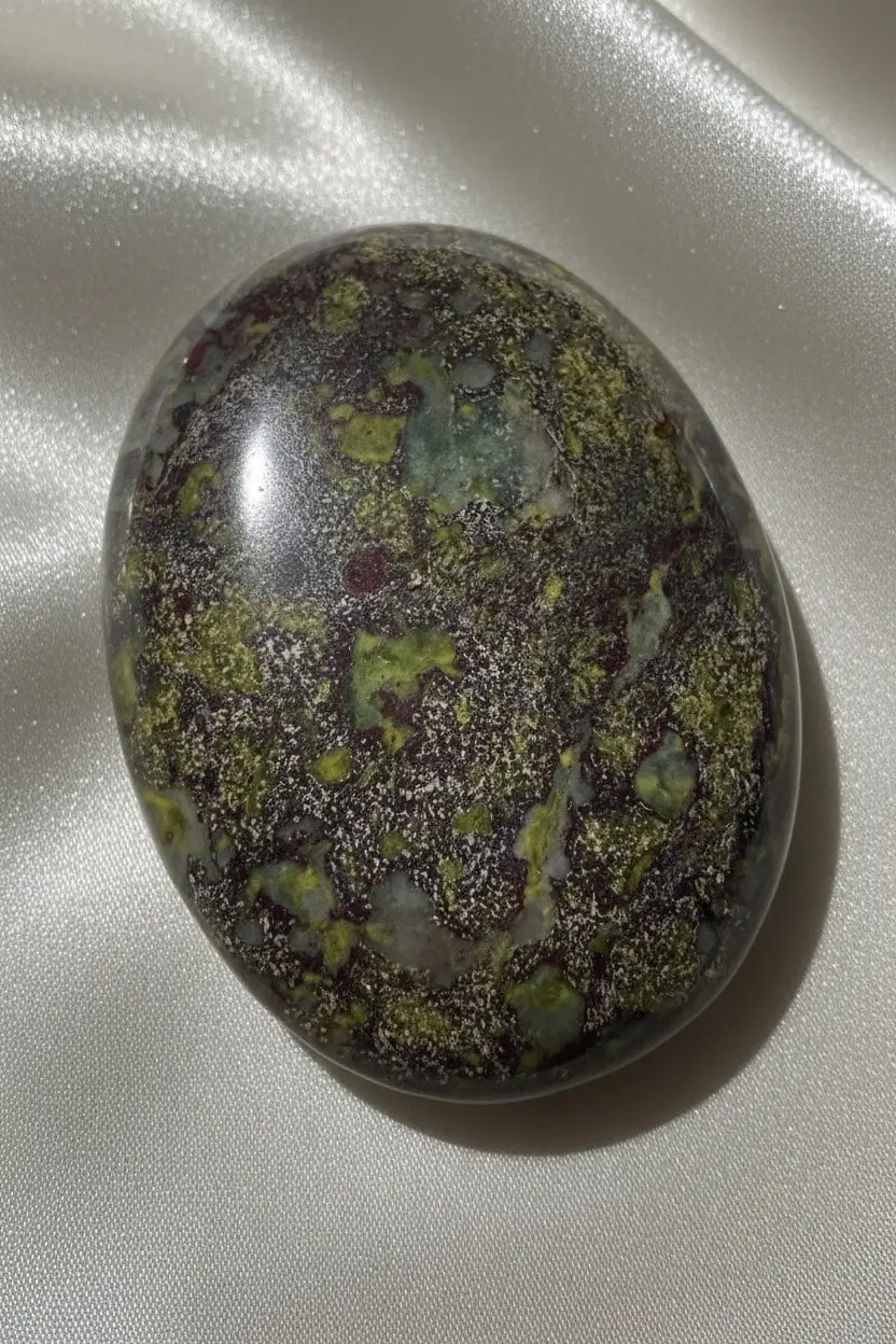 close up of a dragonsblood rystal polished stone