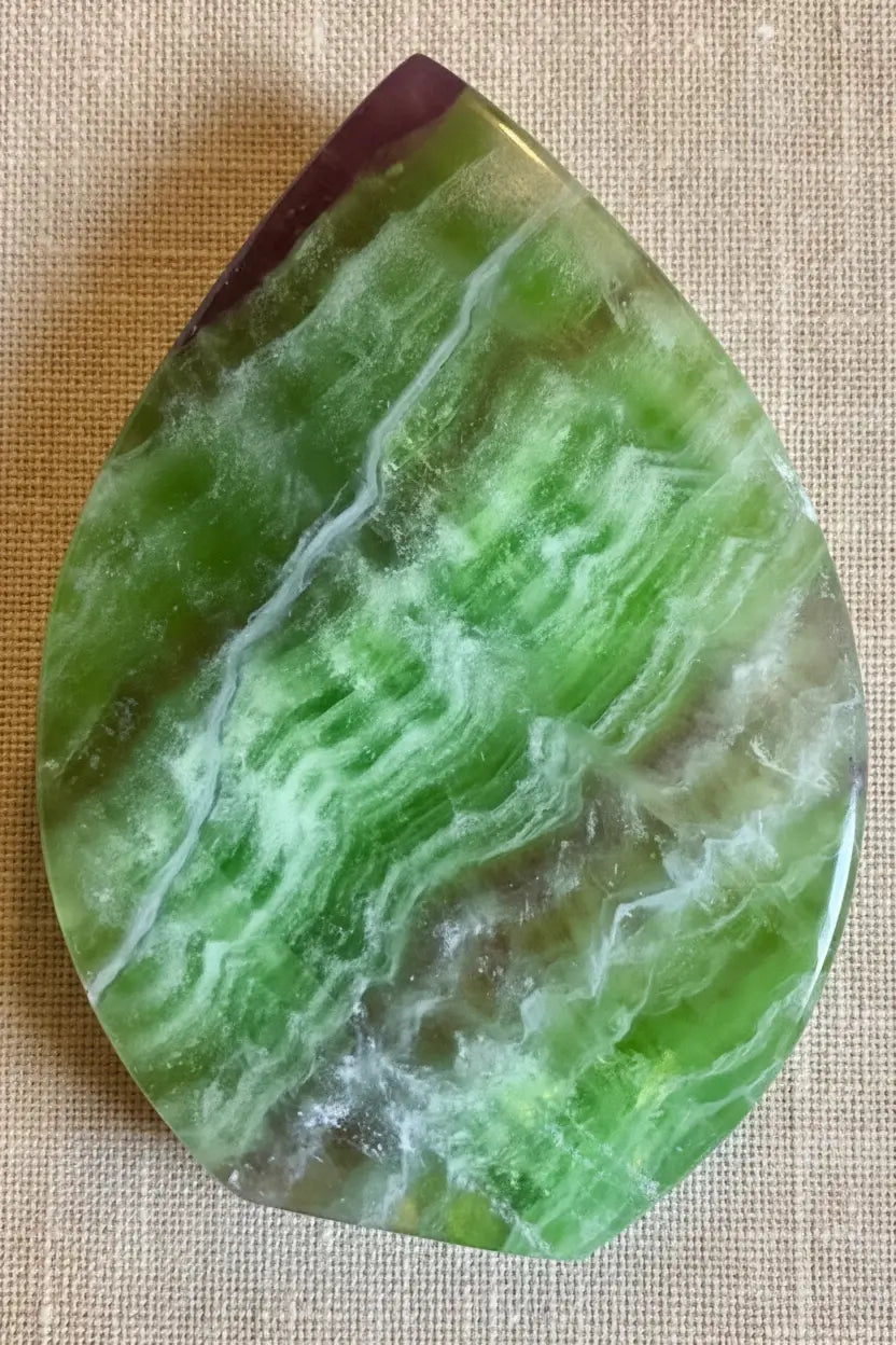 Green and purple fluorite freeform crystal front view