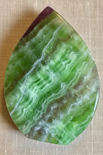 Green and purple fluorite freeform crystal front view