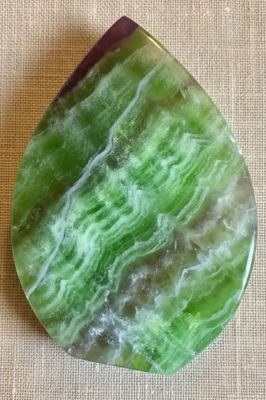 Green and purple fluorite freeform crystal front view
