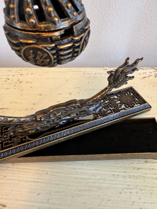 Brass dragon incense holder with lattice burner side view