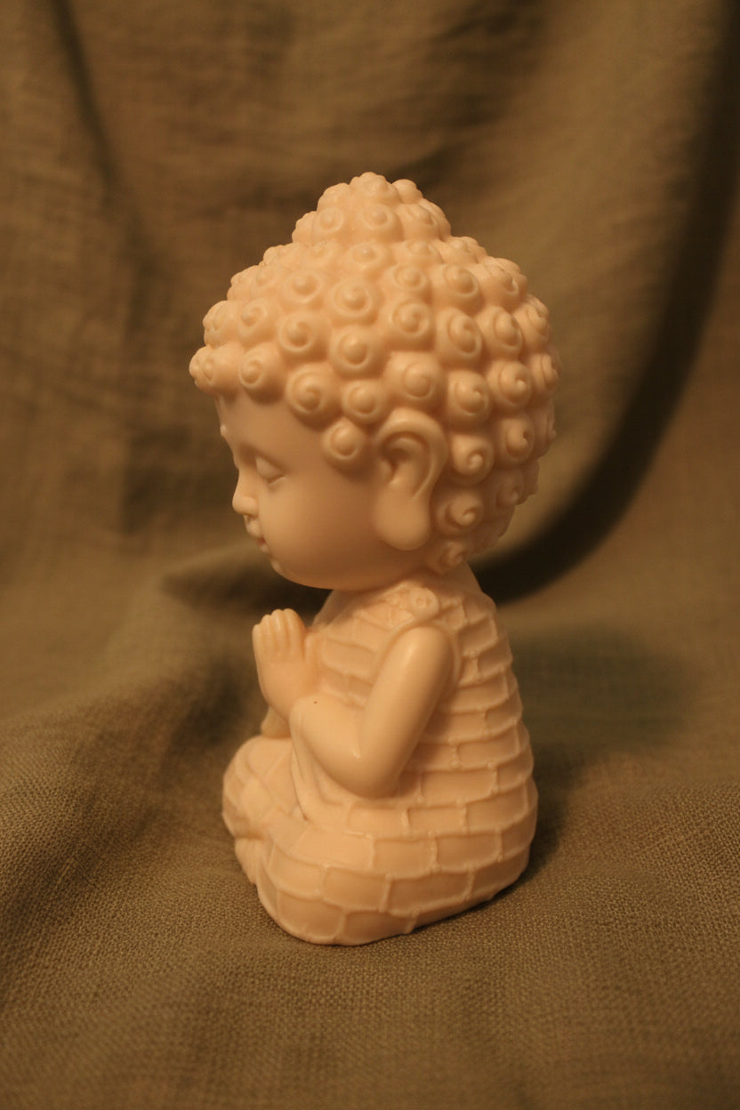 baby buddha in a praying pose 