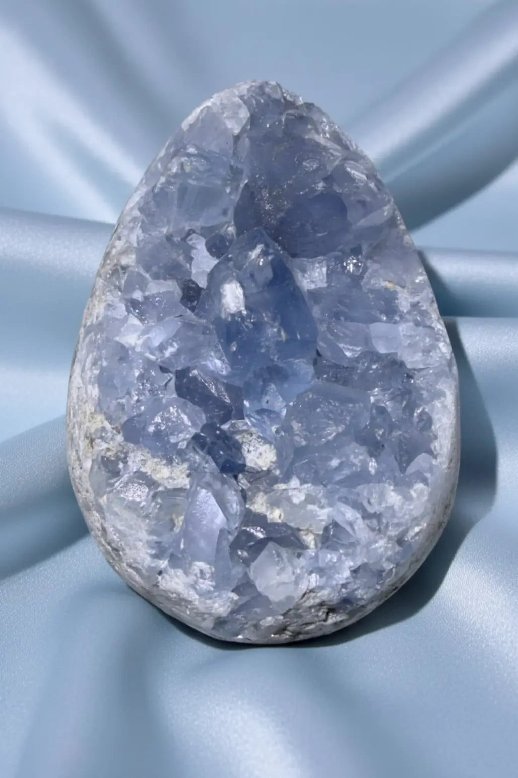 Celestine Geode on a blue cloth