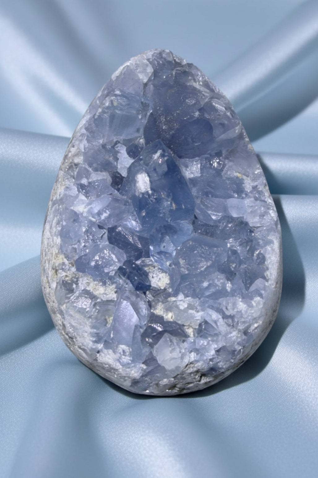 Celestine Geode on a blue cloth
