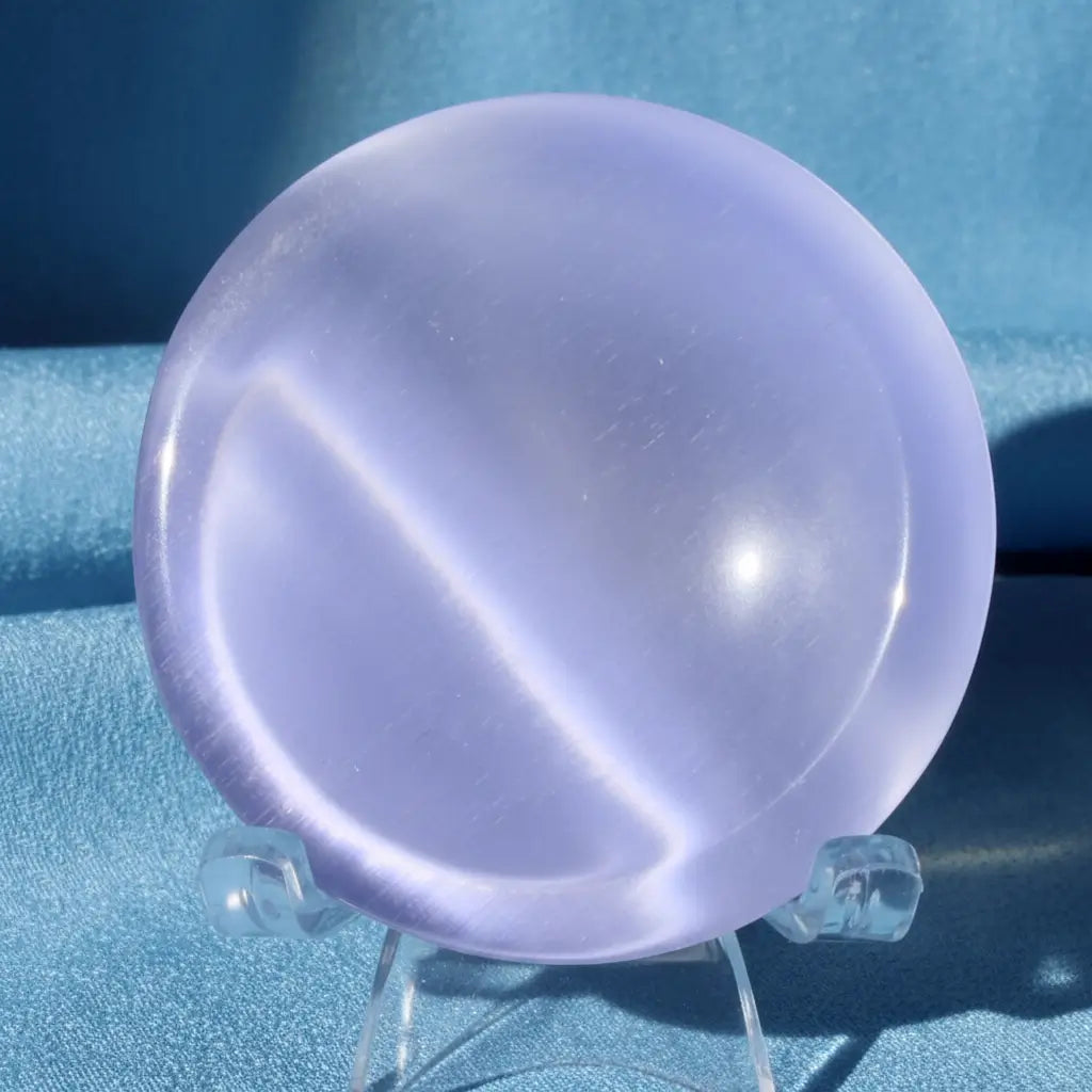 chartoyant selenite bowl close up pretty blue on a stand