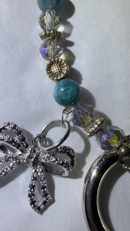 close up of pretty Larimer, clear quartz and silver mobile phone wristler
