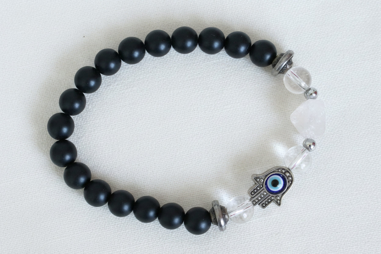 beautiful 9mm black obsidian bead bracelet, elastic, clear quartz beads, a clear quartz pyramid and hamsa hand with a spinning evil eye for protection 