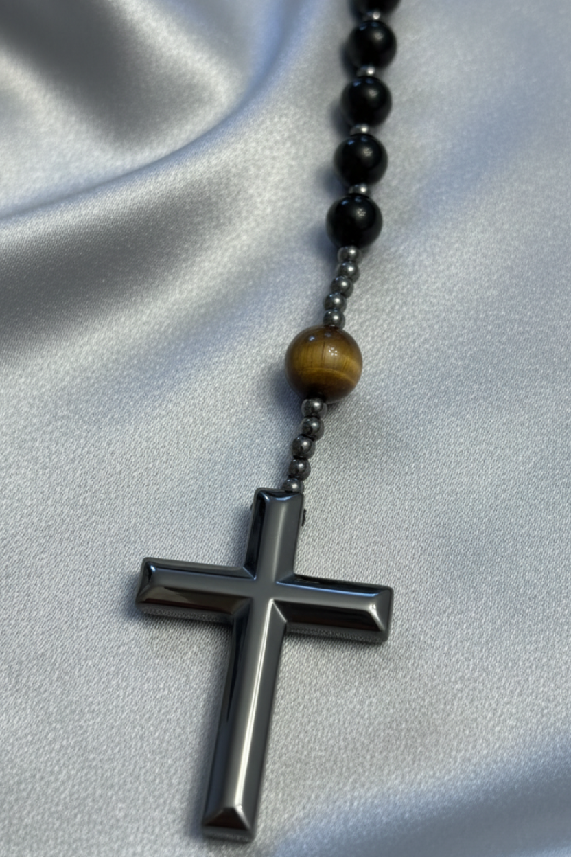 Hematite cross on a hematite bead, tigers eye, and black obsidian rosary