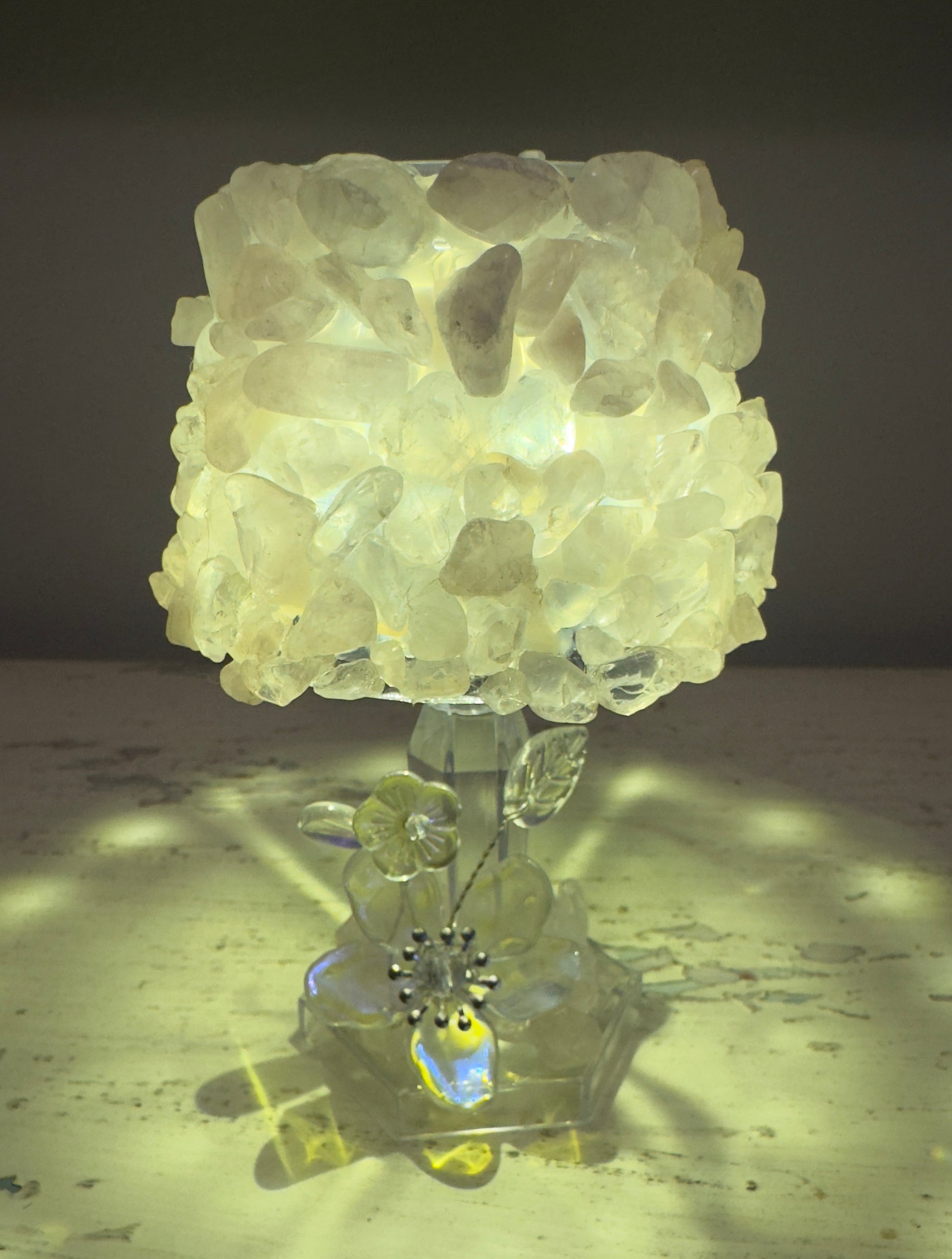 Quartz crystal lamp with flower base.