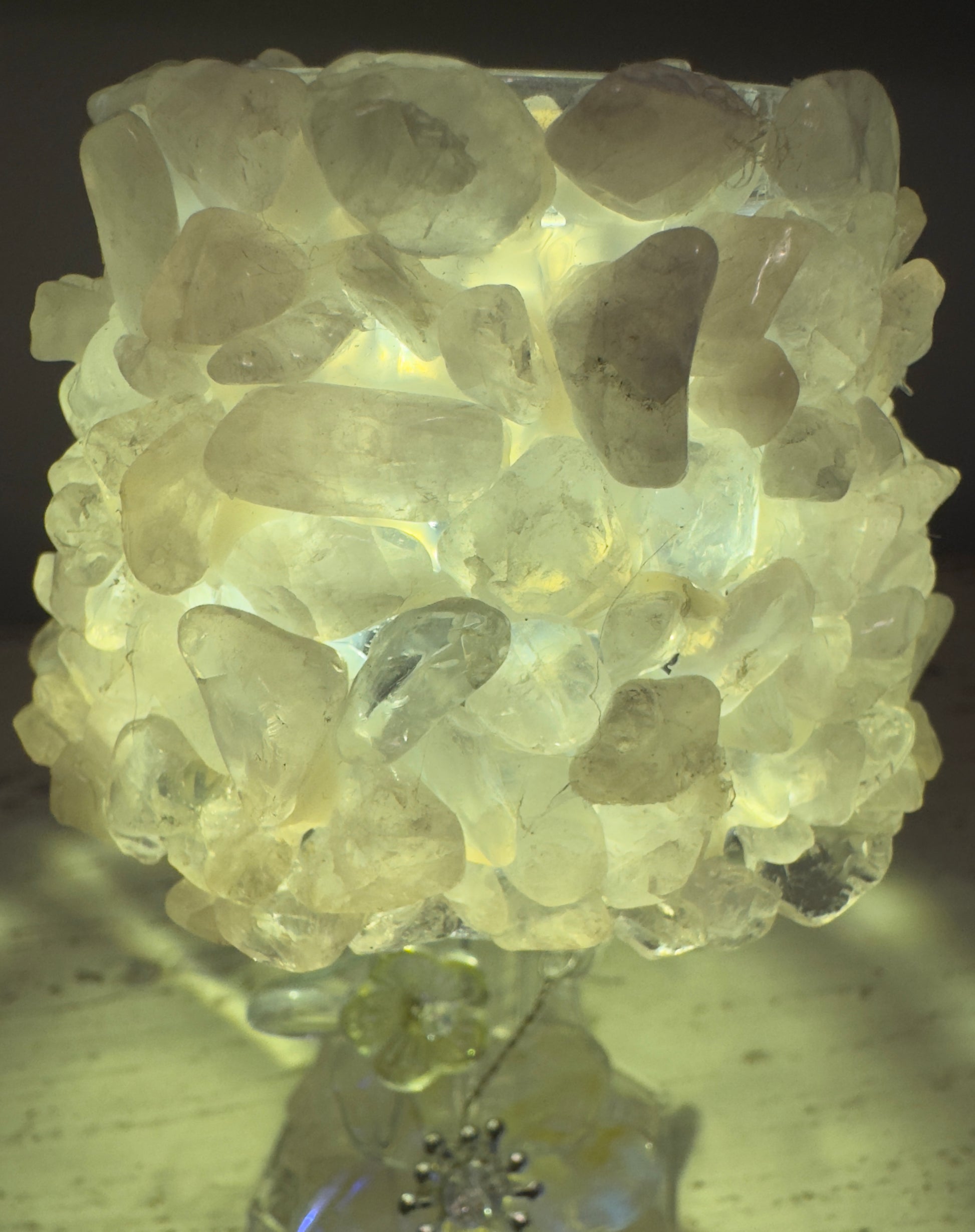 Lamp covered in translucent stones.