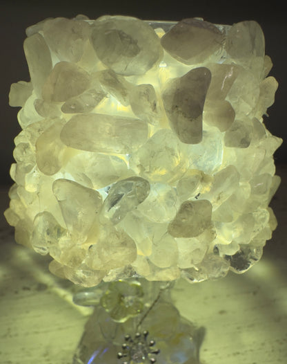 Lamp covered in translucent stones.