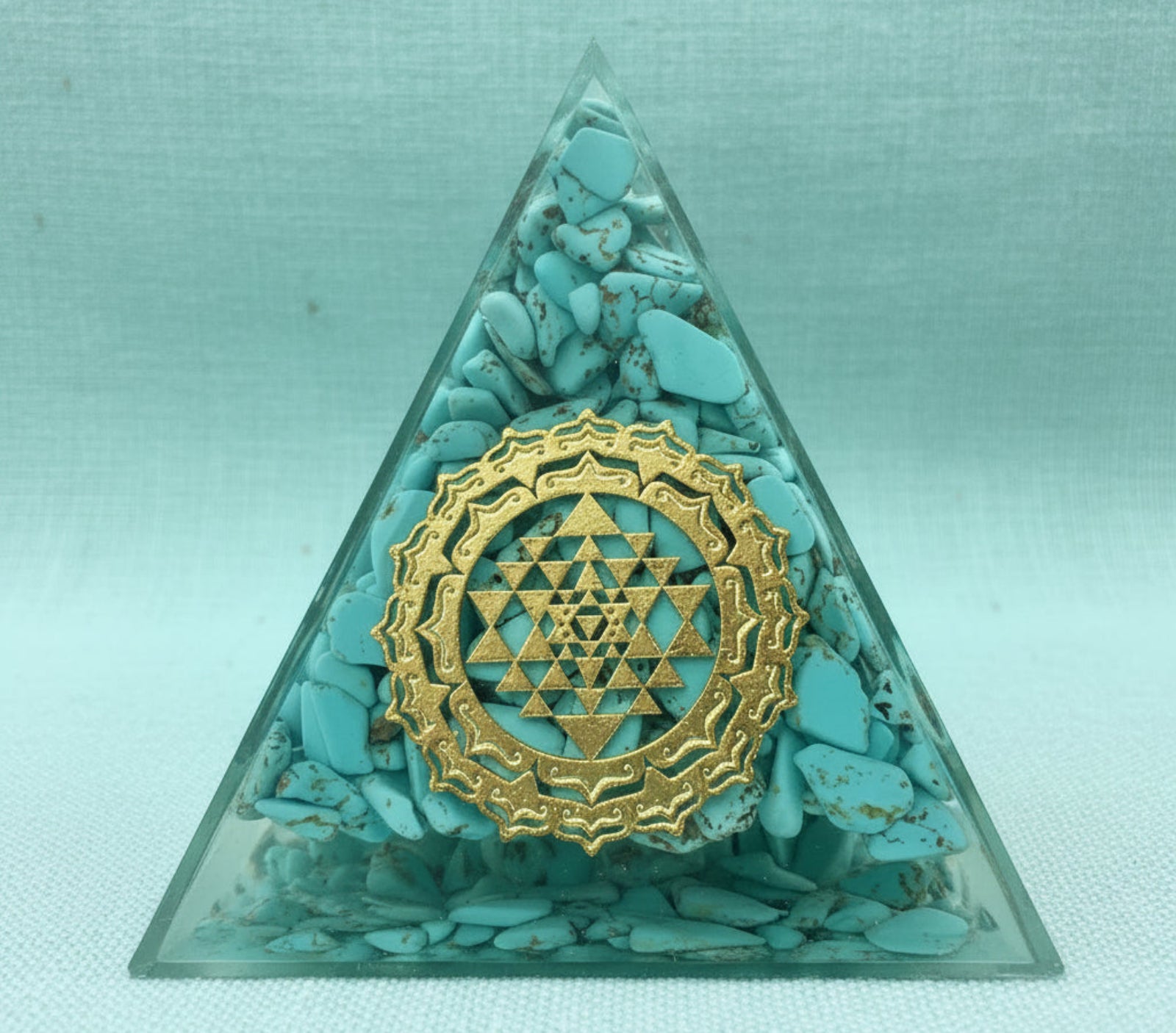 Turquoise Sri Yantra orgonite pyramid with copper and crystal accents