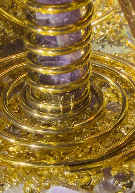 Amethyst point and copper coil orgonite pyramid close-up