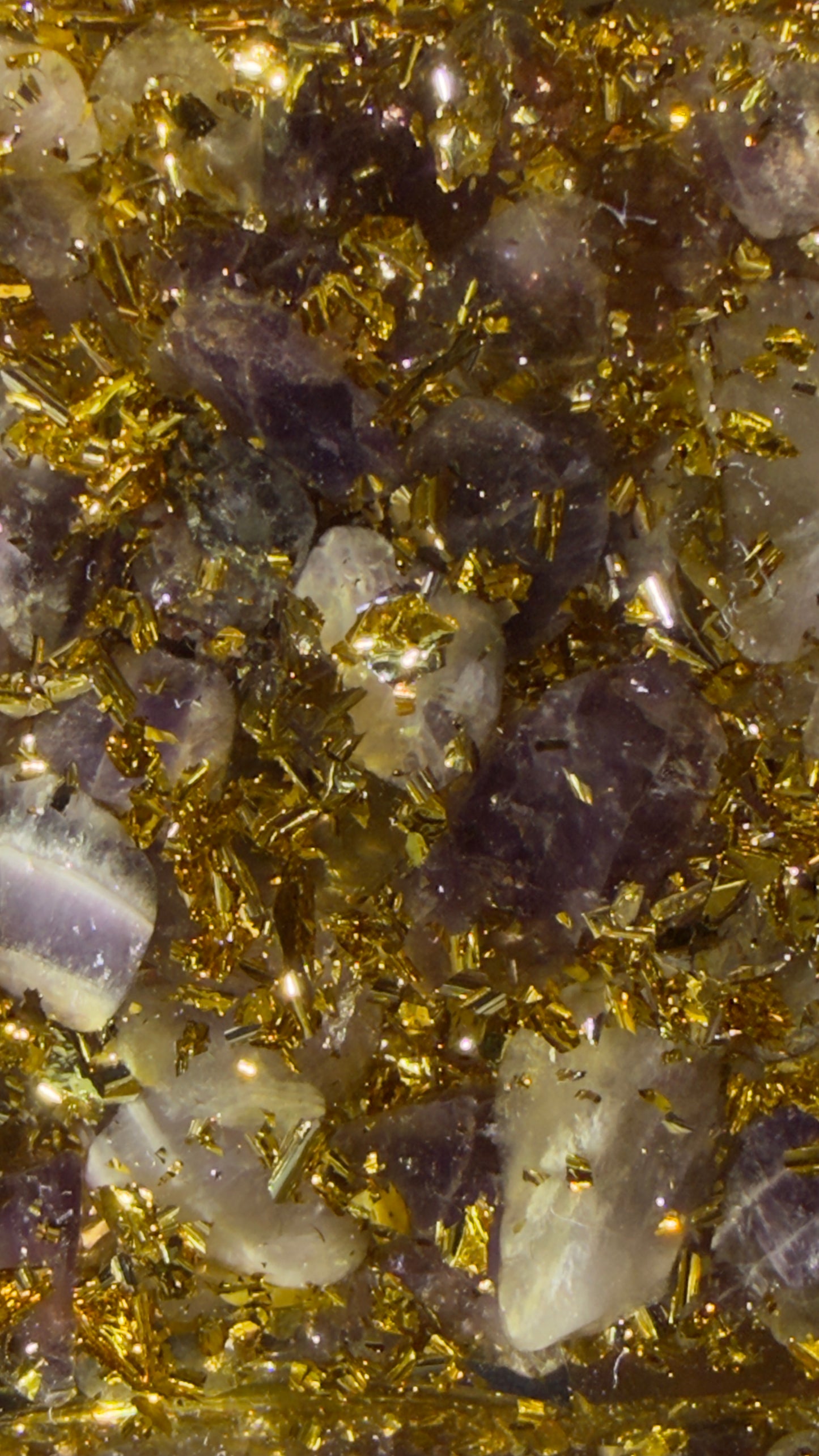 Amethyst point and copper coil orgonite pyramid close-up