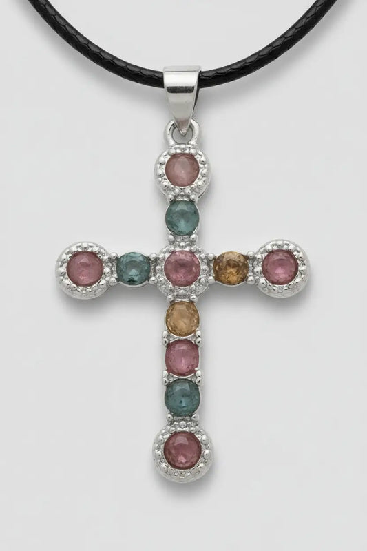 Gemstone cross pendant necklace on display.