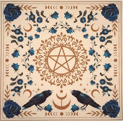 A square printed cloth featuring a cream background with blue roses, crows, crescent moons, floral motifs, and a central pentagram design.