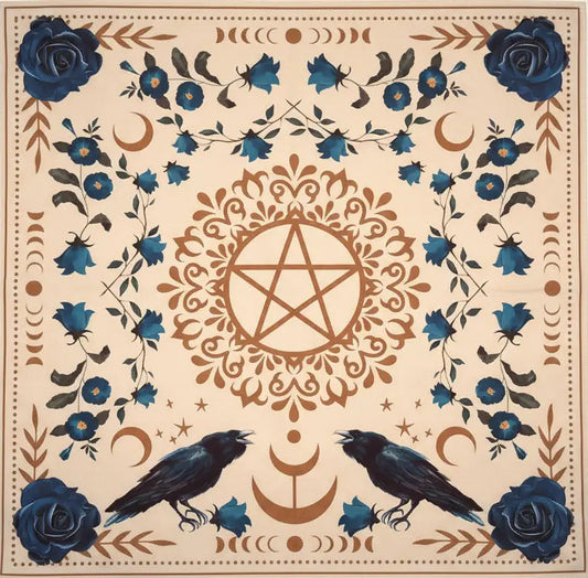 A square printed cloth featuring a cream background with blue roses, crows, crescent moons, floral motifs, and a central pentagram design.