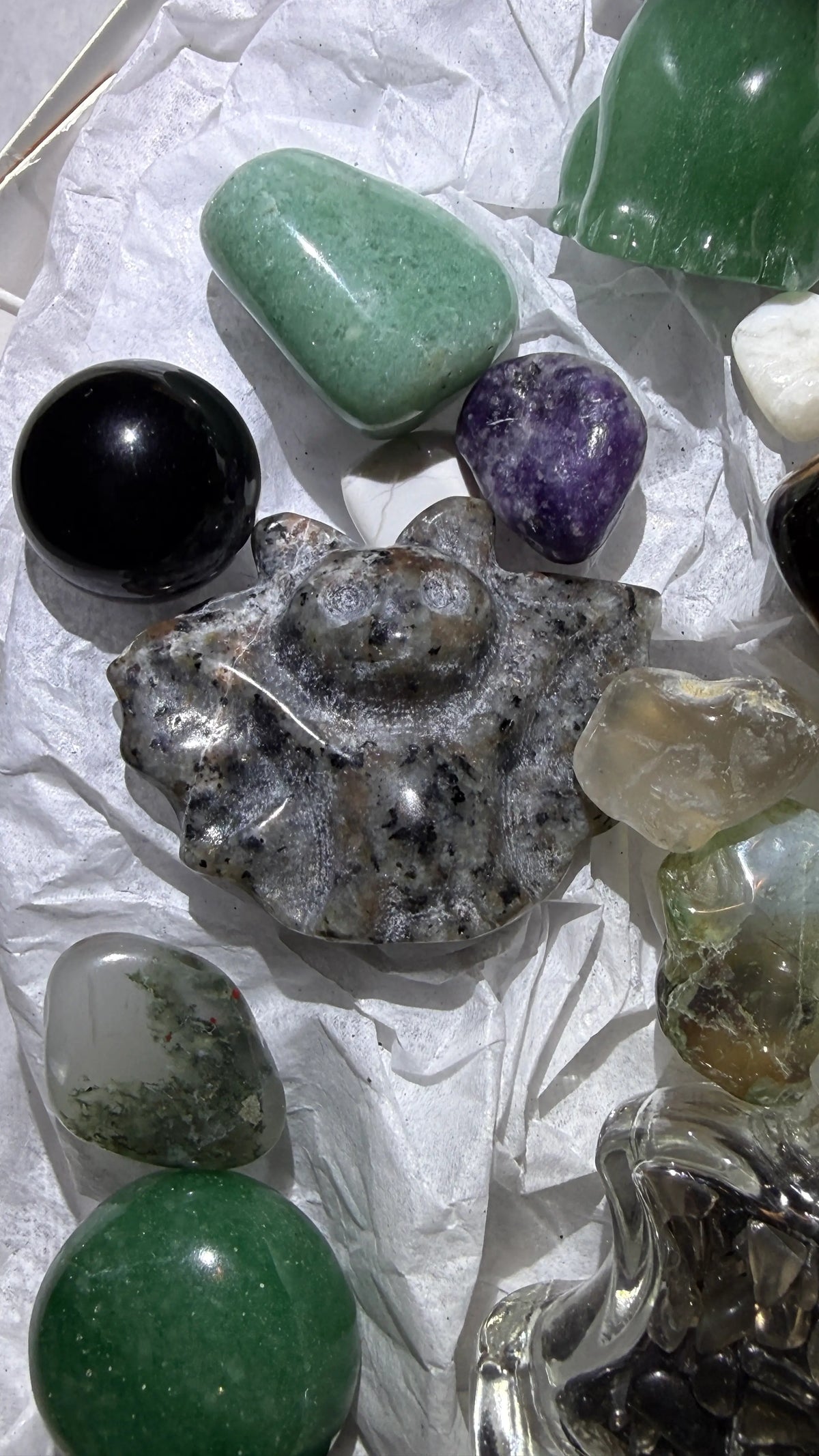 Close up photo of contents Spellcaster’s SidekicksSet Yooperlite carved bat ], aventurine tumbles, black obsidian sphere