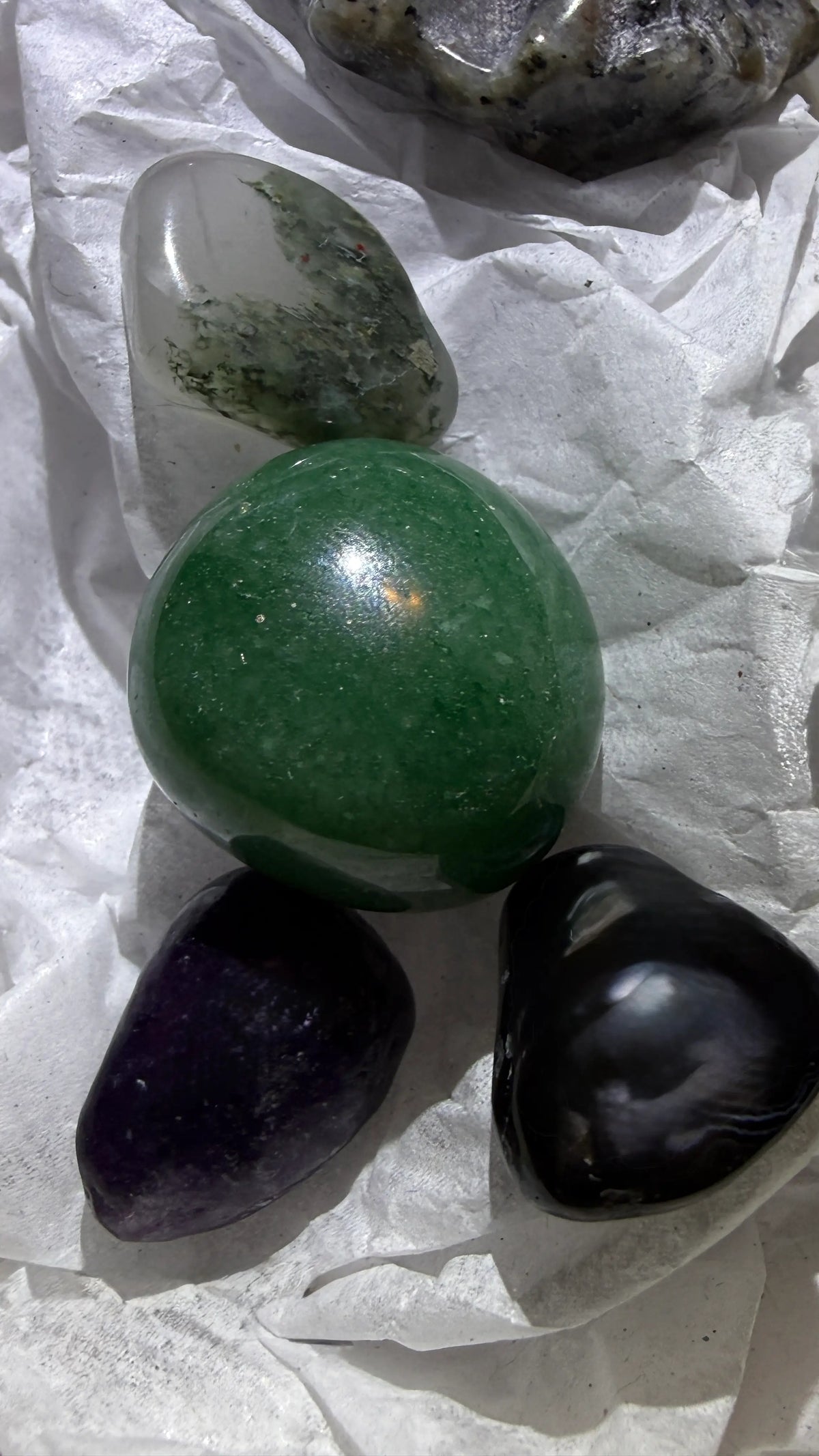 close up photo components garden quartz aventurine and obsidian polished tumbles