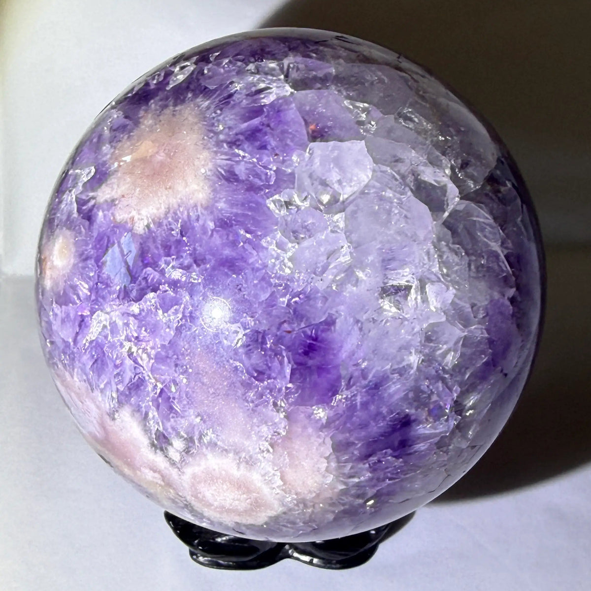 large amethyst sphere with matrix in tact and natural inclusions