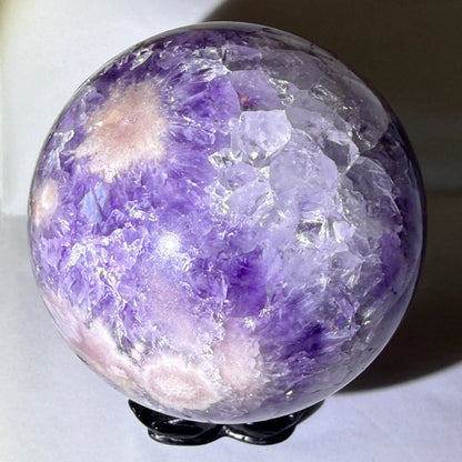 large amethyst sphere with matrix in tact and natural inclusions