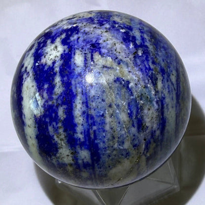 natural lapis lazuli sphere with deep blues, light blues, pyrite and white banding and inclusions