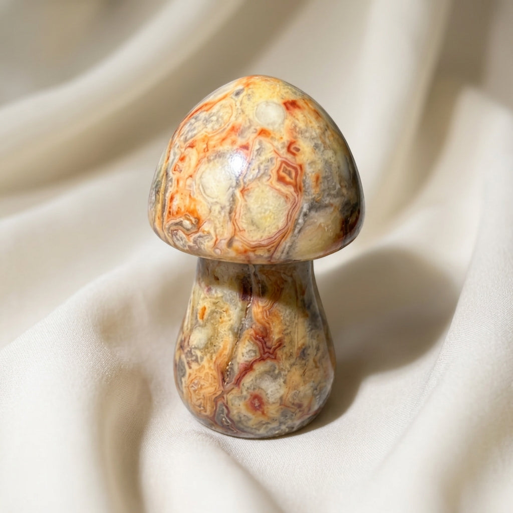 close up showing bright yellows, copper colors natural swirls, polychrome jasper mushroom.  hand carved