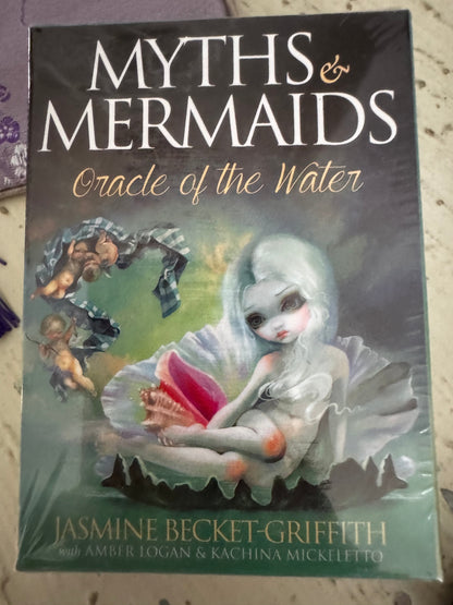 Sealed oracle deck, "Myths & Mermaids," with fantasy art by Jasmine Becket-Griffith, featuring cherubs, a mermaid, and a seashell.