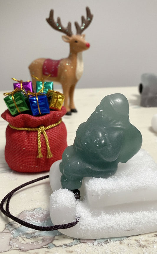 White calcite and green calchedony Santa and sleigh crystal carving