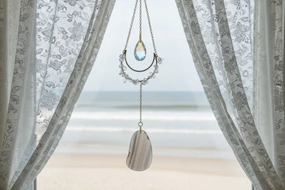 Clear Quartz and Agate Suncatcher Crystal Window Prism on wooden background