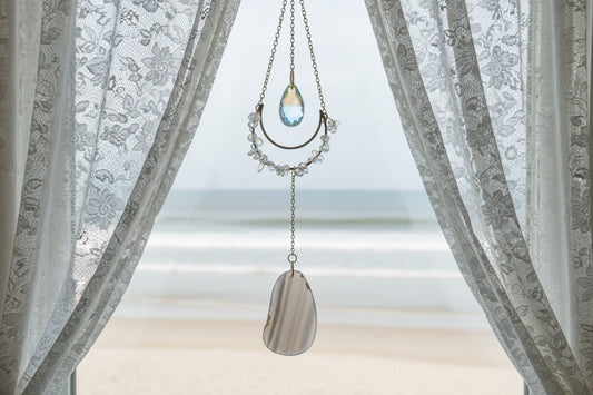 Clear Quartz and Agate Suncatcher Crystal Window Prism on wooden background