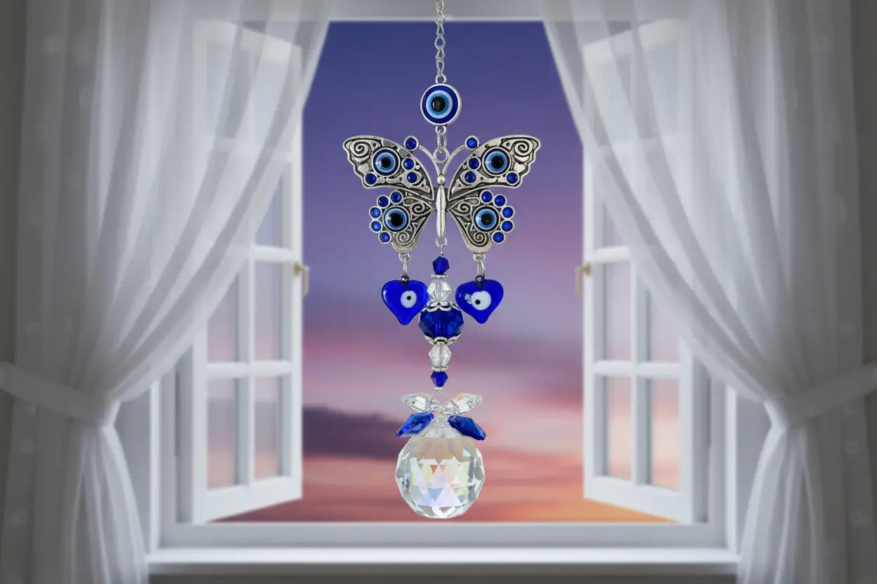 Blue Evil Eye Butterfly Suncatcher with crystal prism in a window