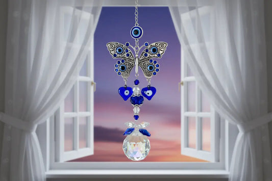 Blue Evil Eye Butterfly Suncatcher with crystal prism in a window