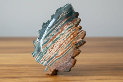Green Jasper trinket dish colors deep green, rust orange, some peach, hand carved into a leaf 