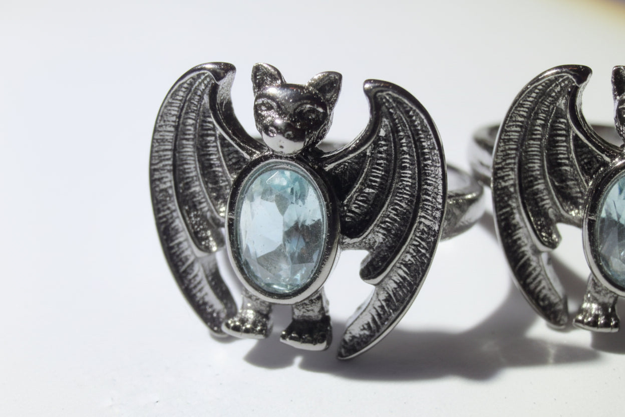 alloy metal adjustable bat shaped ring with aquamarine stone 
