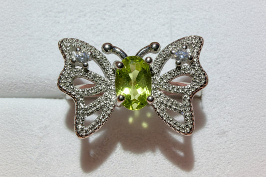 silvery butterfly ring with peridot stone and rhinestones 
