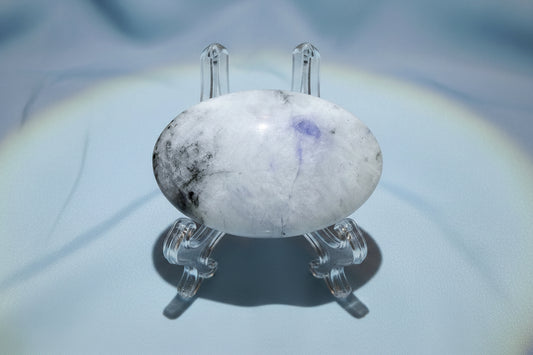 rainbow moonstone palm stone with centipede fractures and blue