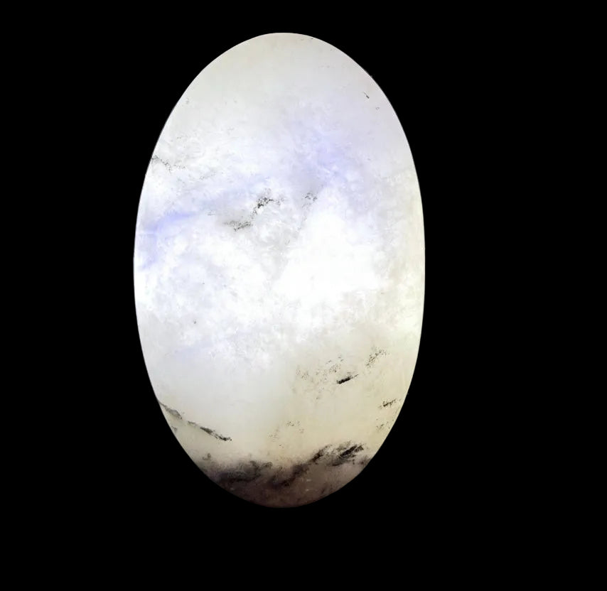 rainbow moonstone palm stone with caterpillar fractures and light behind