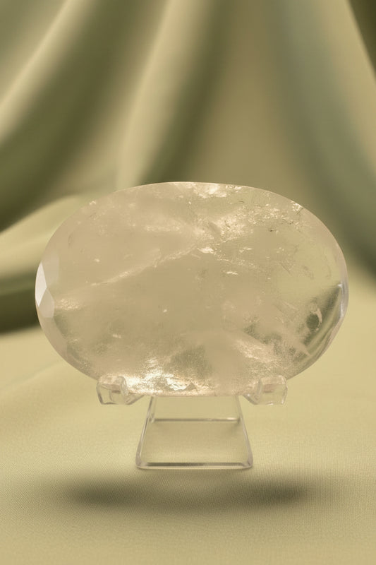 Close up clear quartz polished stone on a stand