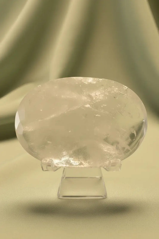 Close up clear quartz polished stone on a stand
