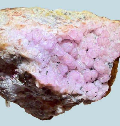 Cobaltoan Calcite specimen with natural Hematite inclusions front view