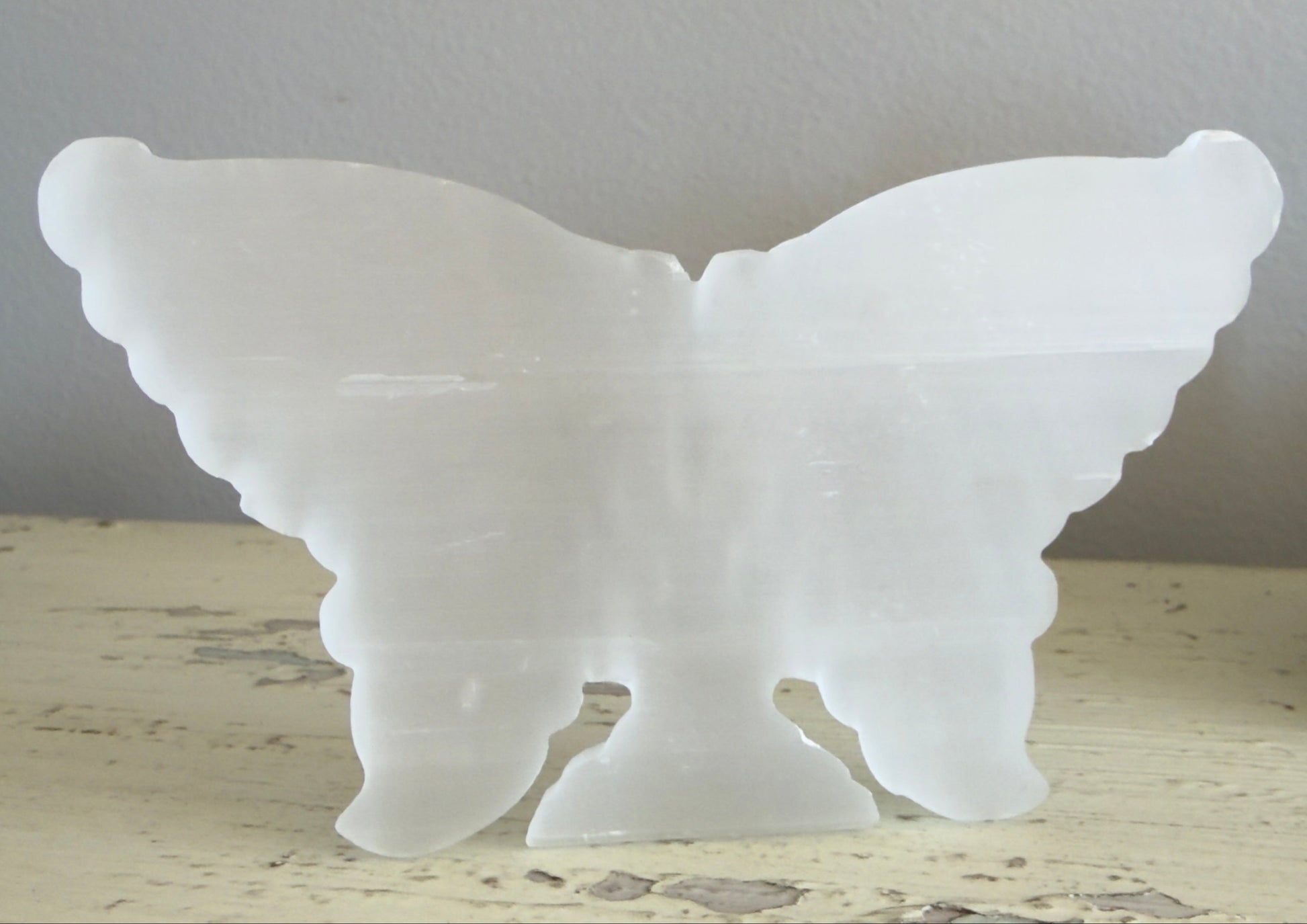 Satin Spar butterfly carving showing carved wing details