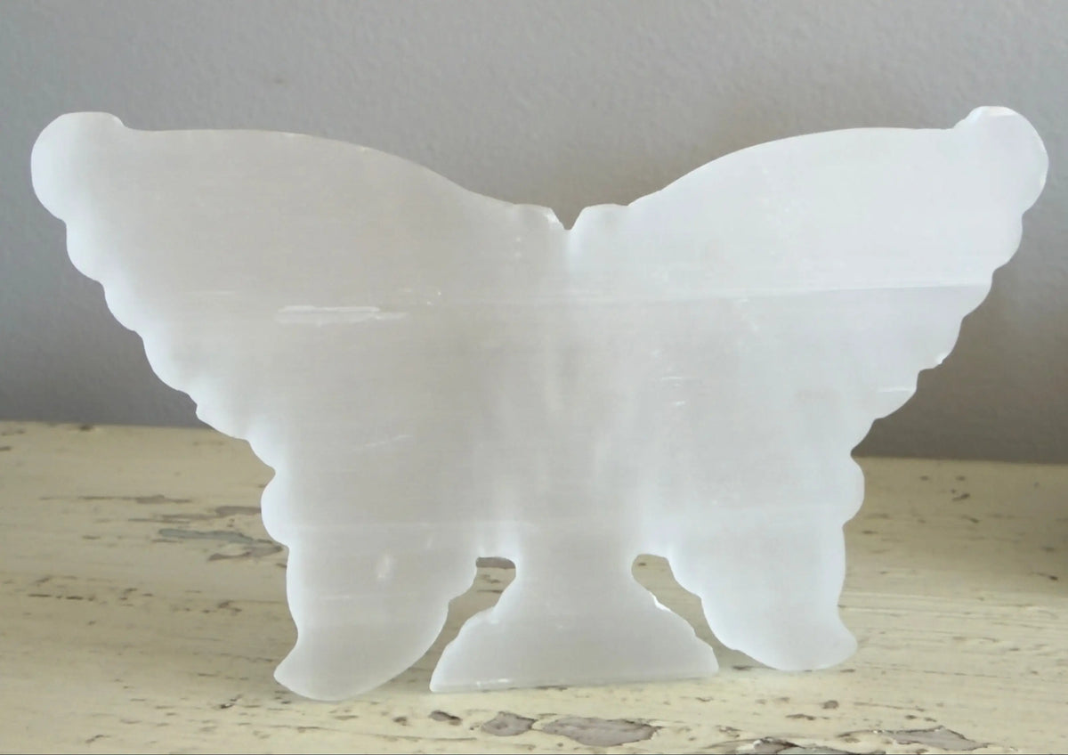 Satin Spar butterfly carving showing carved wing details