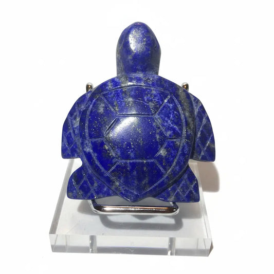 A carved blue lapis lazuli turtle figurine shown from the back visible.