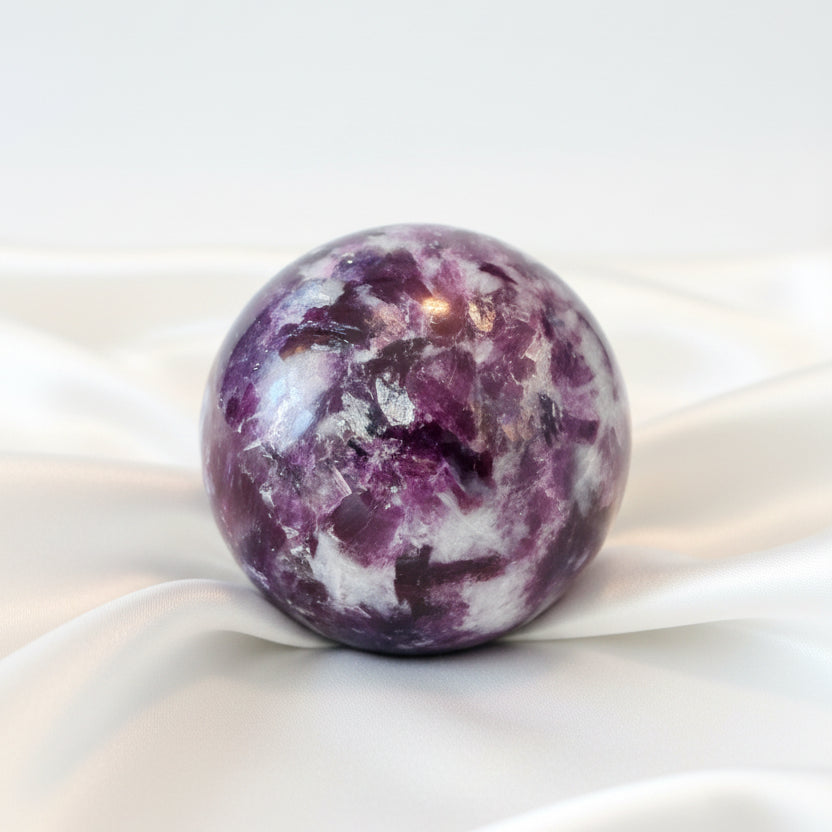 A polished lepidolite purple  crystal sphere  