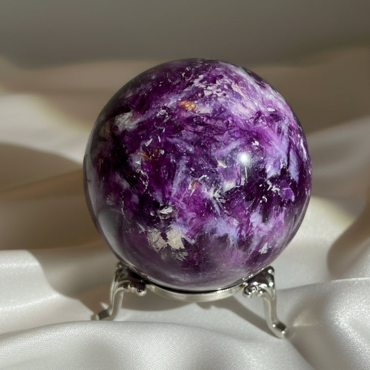 Close up dark purple lepidolite sphere